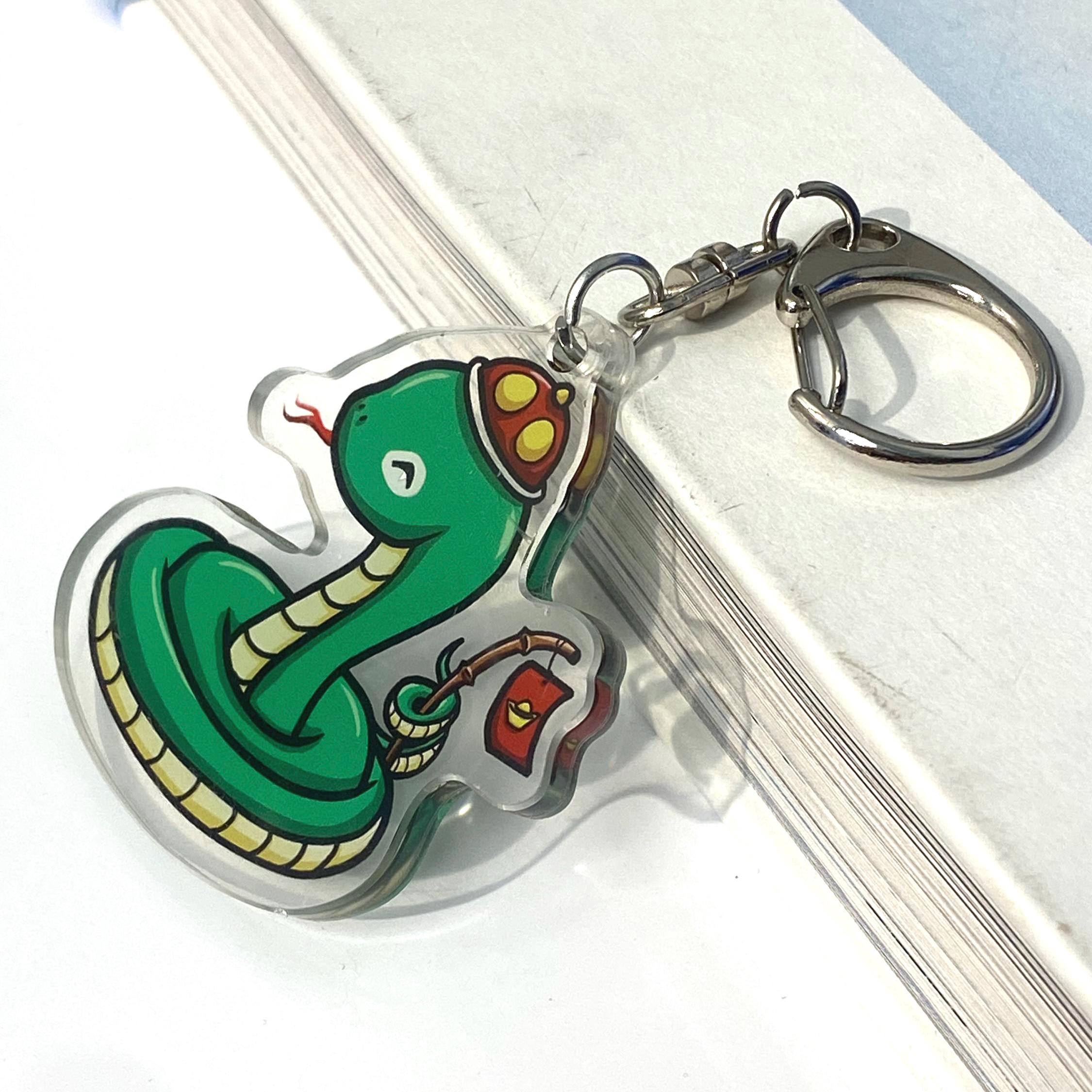 Acrylic Year of the Snake Wearing Hat Holding a stick with a Red Li Xi Envelope Cute Keychain